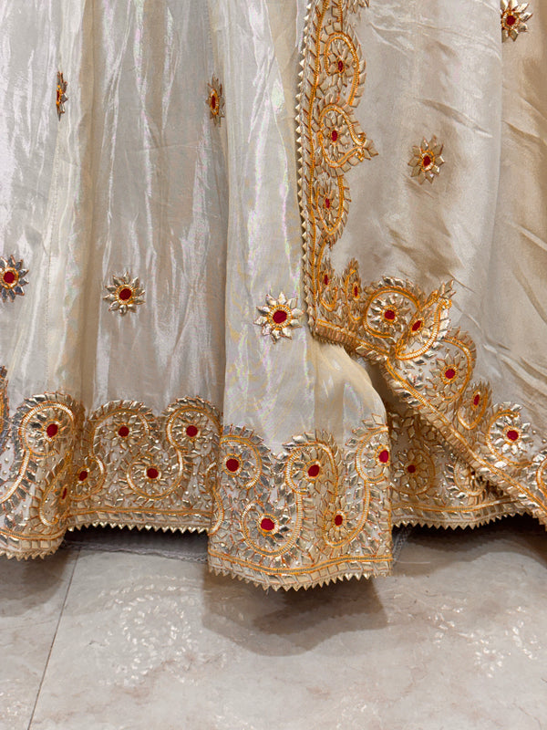 Pure tissue lehenga with kacchi Patti hand work .