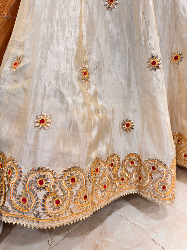 Pure tissue lehenga with kacchi Patti hand work .