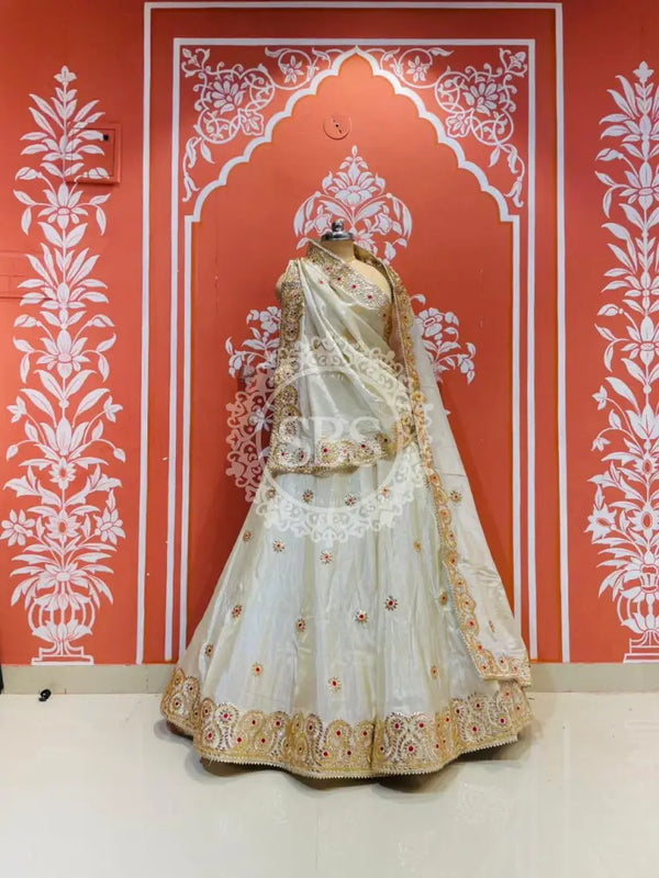 Pure tissue lehenga with kacchi Patti hand work. Off white / Free Size