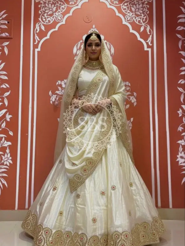 Pure tissue lehenga with kacchi Patti hand work. Off white / Free Size